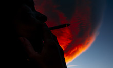 Girl Smoking With A Red Cloud