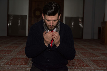 Muslim man praying in mosque