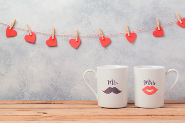 Wall Mural - Valentines day romantic dating concept with couple of coffee cups.