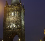 Fototapeta Londyn - Old town bridge tower, Prague by night, the famous romantic capital of Chech republic, Europe.
