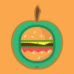 apple and cheeseburger. fast food and fruit, healthy food agains