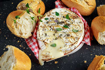 Wall Mural - Homemade Baked Camembert cheese with thyme and fresh bread