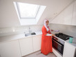 © Jasmin Merdan - Muslim traditional clothing woman in white modern kitchen