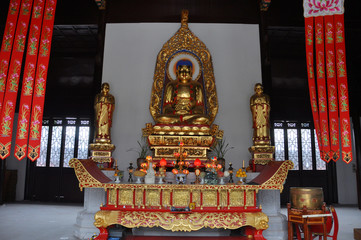 Gilt-Bronze Statue of Vairocana Buddha in Pilu Temple, Nanjing, Jiangsu Province, China. Pilu Temple was built in 1522 AD, and is one of the most antique temples in Nanjing.