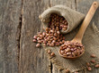 pinto beans on wooden surface