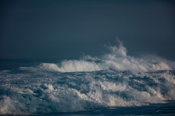 Wall Mural - Huge waves crashing in ocean. Seascape environment background. Water texture with foam and splashes. Hawaiian surfing spots with nobody