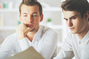 Wall Mural - Handsome boys doing paperwork