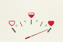 Love Meter / Creative Valentines Concept Photo Of Speedometer With Hearts On Grey Background.