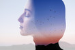© rh2010 - Double exposure photo with woman silhouette and sunset sky with mountains and birds. Freedom and travel concept