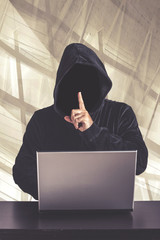 hacker with laptop. internet security concept