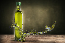 Bottle Of Olive Oil With Splashes