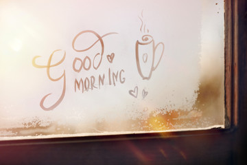good morning - the inscription on the frosty window. positive. sunshine