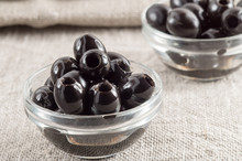 Black Pitted Marinated Olives In A Glass Cup