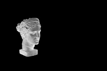 Wall Mural - Marble head of young woman, ancient Greek goddess bust isolated on black background with copy space for text.