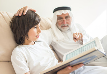 Wall Mural - Man with kid reading book