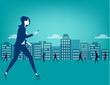 Businesswoman walking on city using a smart phone
