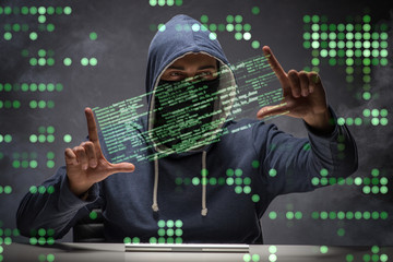 young hacker in data security concept