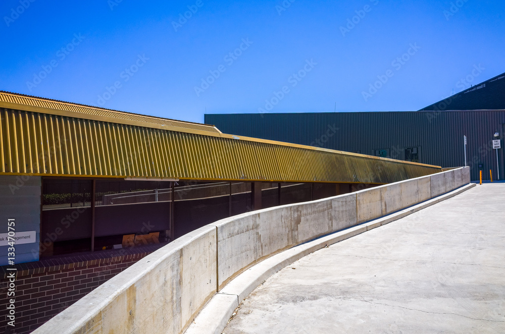 Concrete ramp alongside a building. Cement slope near an office ...