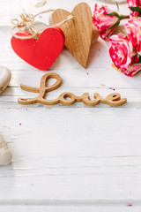 Canvas Print - wooden word LOVE with the roses and hearts - Valentines day background