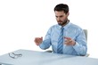 © WavebreakMediaMicro - Businessman pretending to touch an invisible object at desk