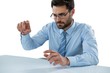© WavebreakMediaMicro - Businessman pretending to touch an invisible object at desk