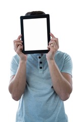 Wall Mural - Man holding a digital tablet in front of his face