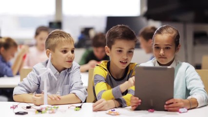 Wall Mural - kids with tablet pc programming at robotics school