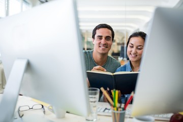 Poster - Graphic designers working at desk
