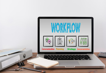 Wall Mural - Workflow concept. Wooden office desk with a laptop.