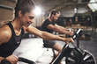 © Flamingo Images - Two young people training on cycling machines