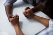 © WavebreakMediaMicro - Close-up of couple holding hands on table in kitchen