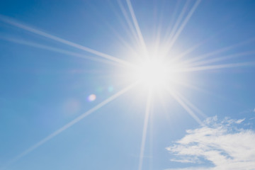 Wall Mural - blue sky with clouds and sun reflection.the sun shines bright in