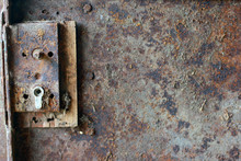 Texture Of Rusty Metal Door With Broken Door Lock