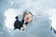 © soupstock - Man scraping snow and ice from car window