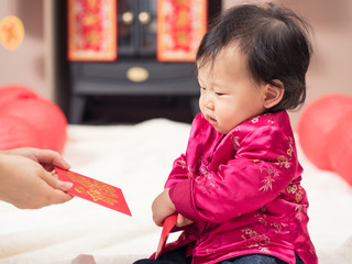 happy baby girl get red envelope with 