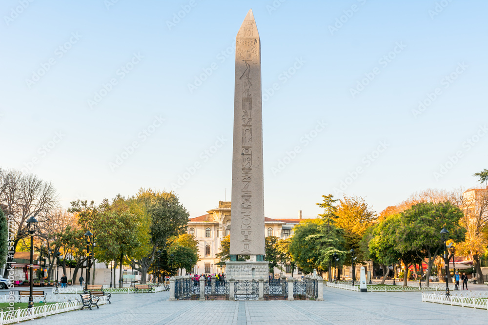 Obelisk of Theodosius (Egyptian Obelisk) near Blue Mosque in the ancient Hippodrome in the morning under golden sunlight in Istanbul, Turkey - obrazy, fototapety, plakaty 