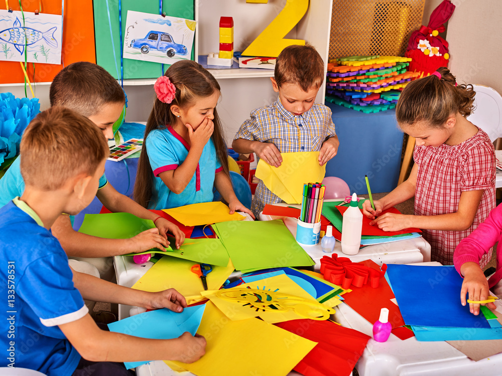 Child cutting paper in class. Kids development and social lerning ...