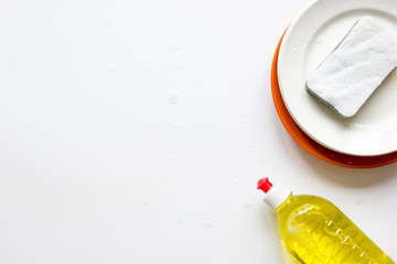 concept of washing dishes on white background top view