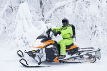 Man Driving Snowmobile