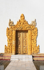 Canvas Print - Old wooden door with carved ornament, Myanmar (Burma)