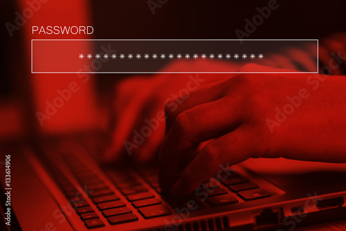 Fotografía Typing online account password on laptop computer keyboard