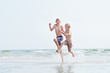 © Johnér - Two boys running on beach