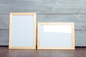 Canvas Print -  photo frames on the wooden wall