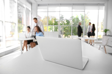 Poster - Business training concept. Laptop on white office table