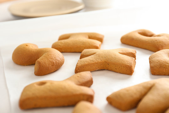 Cookie letters on baking paper, closeup
