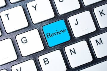 Review button on white computer keyboard