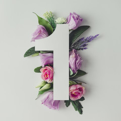 Wall Mural - Creative layout with colorful flowers, leaves and number one. An