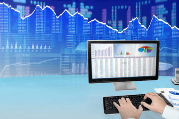 Fototapete - Man analyzing financial data and charts on computer 