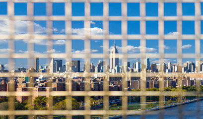 Wall Mural - NYC Panorama Downtown Skyline Background Through a Fence