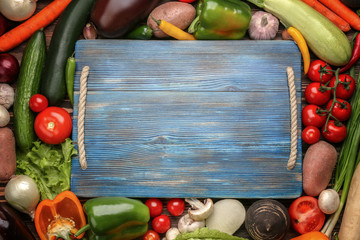 Wall Mural - Empty cutting board and vegetables, close  up